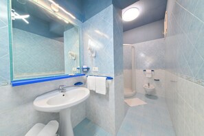 A modern bathroom with a sink, mirror, and shower. - Cobalt (Barano D'ischia)