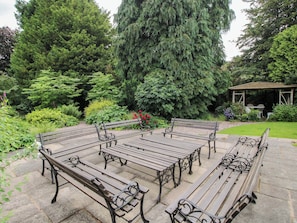 A garden with a gazebo, benches, and a variety of trees. - Apartment 3 (Lydbury North)