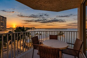 Outdoor dining - Tropical Paradise- Amazing Water, Pool & Sunset Sky Views from Your Private 4th Floor Balcony (Fort Myers Beach)