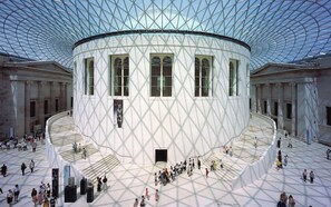 A large, circular building with a glass dome ceiling and a central courtyard. - The Holborn Hideaway by The Design Traveller (London)