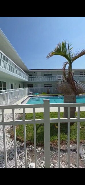 Outdoor pool - Rocket View & 5 minute Walk to the Beach - Immaculate, Remodeled Condo with Pool (Cape Canaveral)