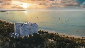 A coastal hotel with multiple high-rise buildings, a beach, and a sunset. - The Diamond Mandala Cham Bay Mui Ne  (Mui Ne)