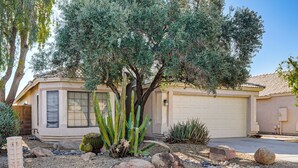 A residential house with a garage, a cactus garden, and a small rock garden. - 2 Mi to Surprise Stadium! Dog-friendly Home, Pool (Surprise)