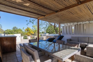 Outdoor dining - Sunset Rooftop Oasis | 2BR Condo | Steps to Beach (Playa del Coco)