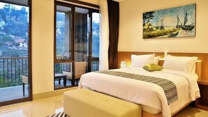 A hotel room with a large bed, a painting of a coastal scene, and a balcony with a view of the surrounding area. - Cempaka 2 Villa Dago Private Pool (Bandung)