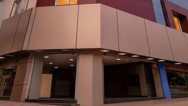 A multi-story building with a sign reading 'fabHOTELS' on the facade. - Embassy Gate Residency  (Chennai)