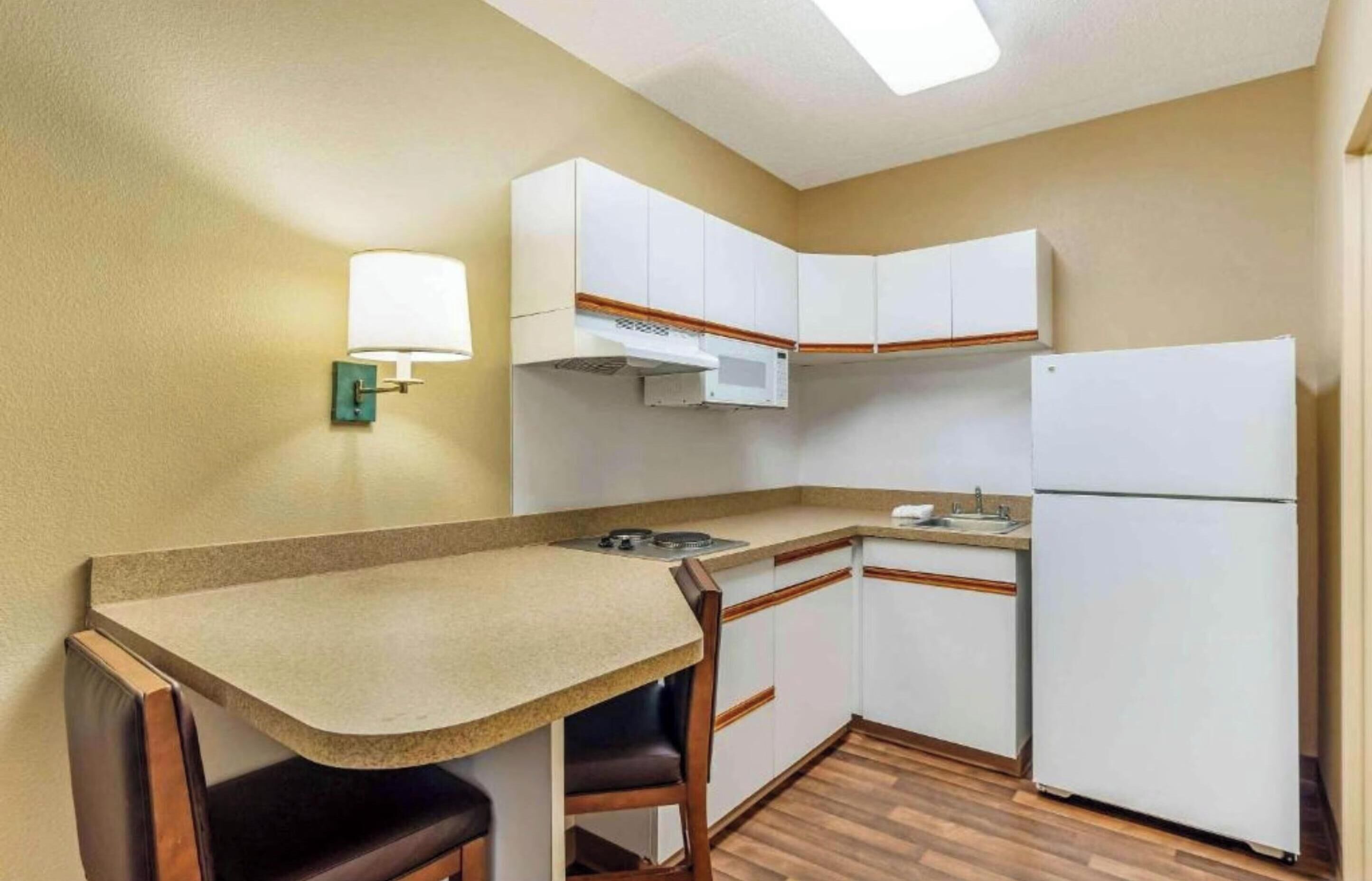 Full-size fridge, microwave, stovetop