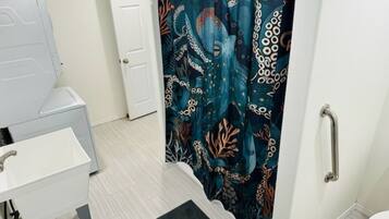 Shower, hair dryer, towels, soap