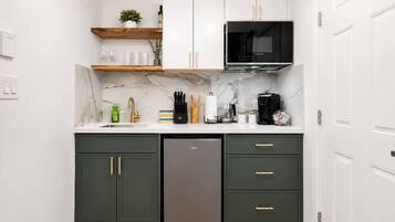 Microwave, stovetop, coffee/tea maker, dining tables