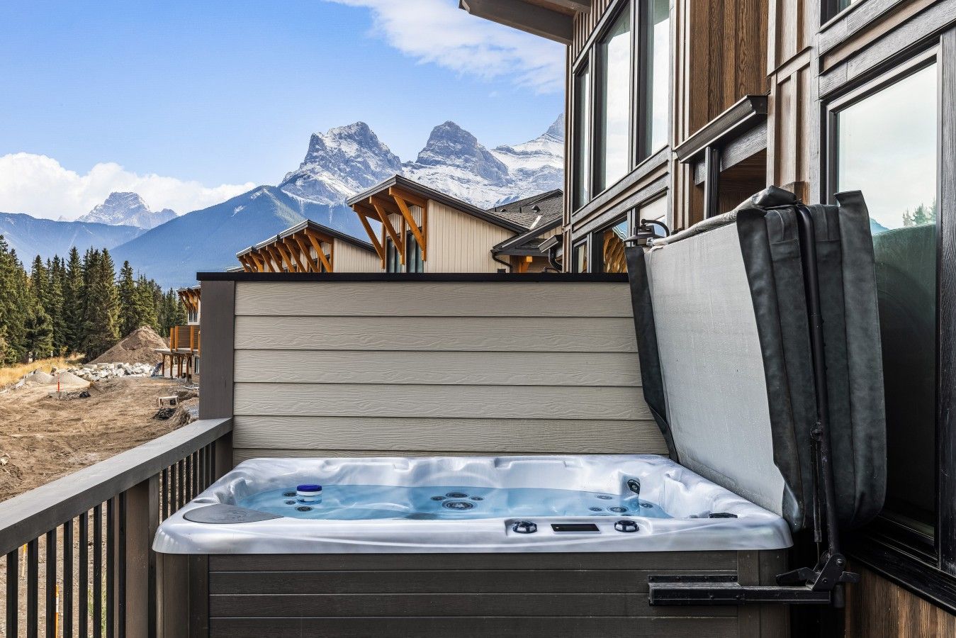 A hot tub on a balcony with a mountain view.