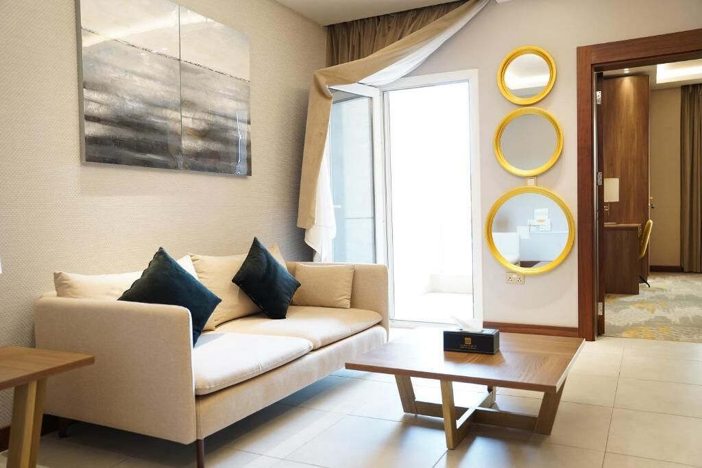 Luxury Suite, Balcony, City View | Living area | Computer monitors, printers
