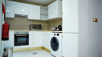 Luxury Suite, Balcony, City View | Private kitchen | Electric kettle