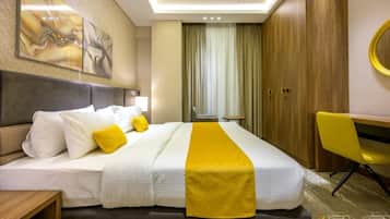 Deluxe Suite, City View | In-room safe, blackout drapes, soundproofing