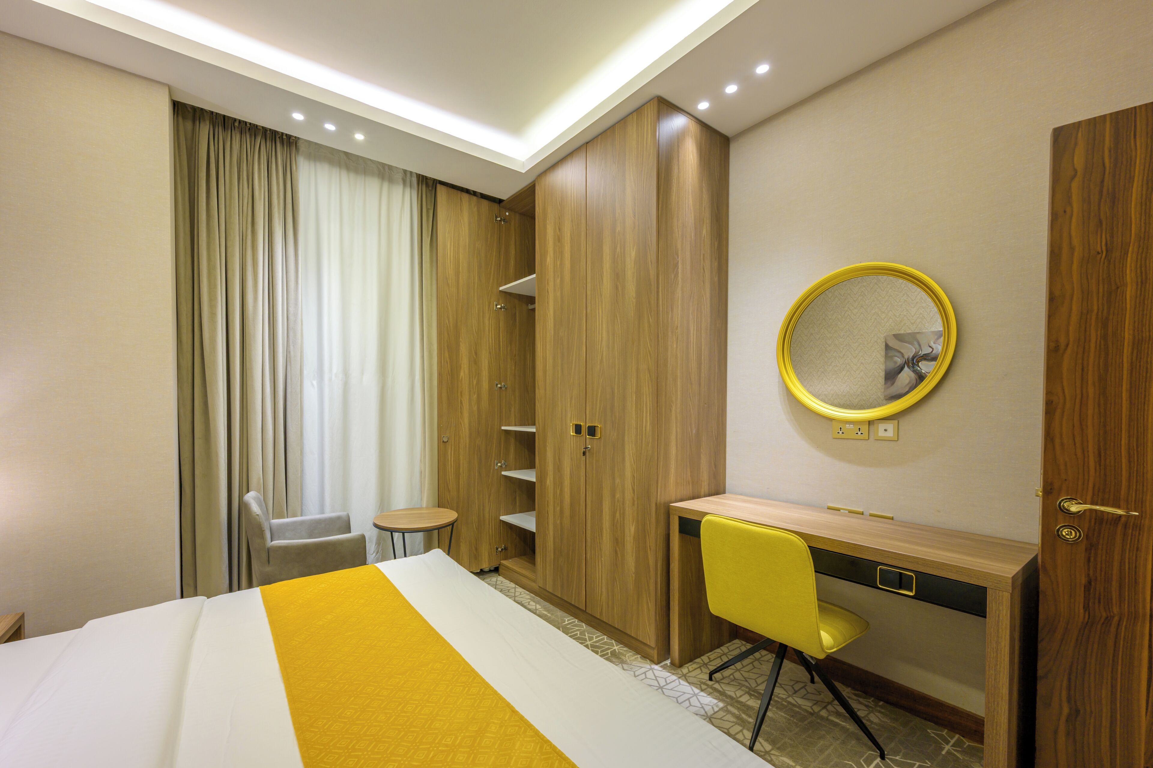Deluxe Suite, City View | In-room safe, blackout drapes, soundproofing, iron/ironing board