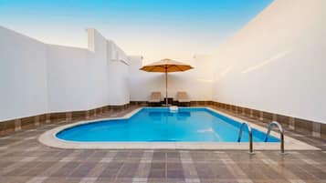 Outdoor pool, pool umbrellas, pool loungers