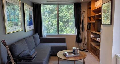 Cozy 2 bedrooms in central Tokyo with private bath and living room.