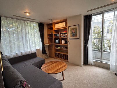 Cozy 2 bedrooms in central Tokyo with private bath and living room.