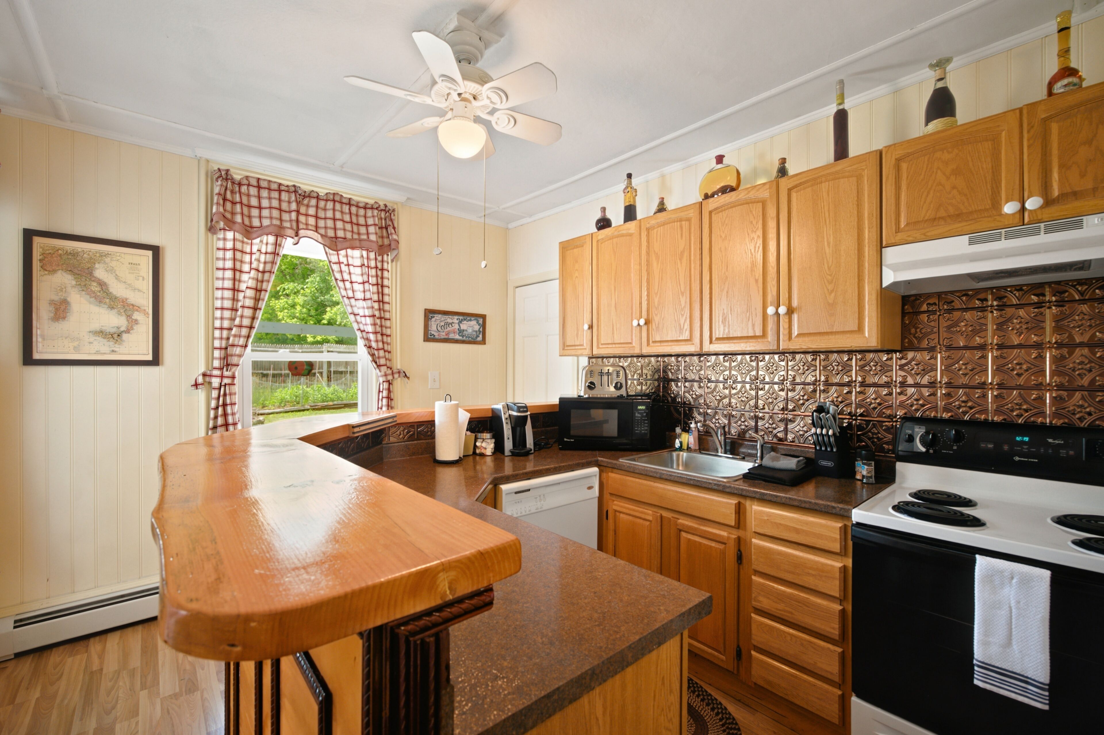 Fridge, dishwasher, coffee/tea maker, cookware/dishes/utensils