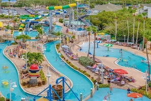 A water park with multiple pools, slides, and a large water slide. -  Three Palms 3BR / sleeps 8 / beach 5 min. / backs to nature trail & park w/lake (Largo)