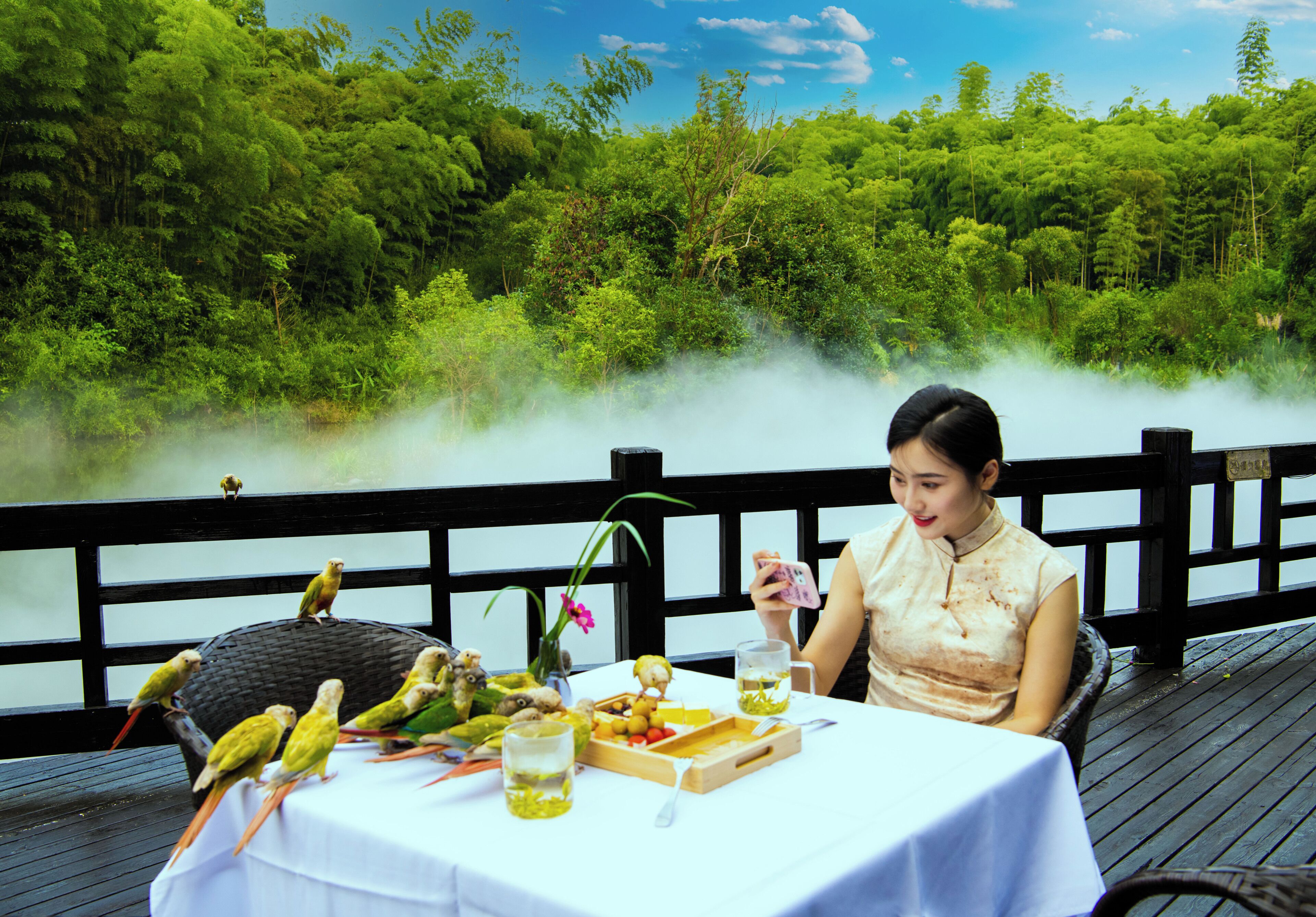 A table with a white tablecloth, a basket, and a drink.