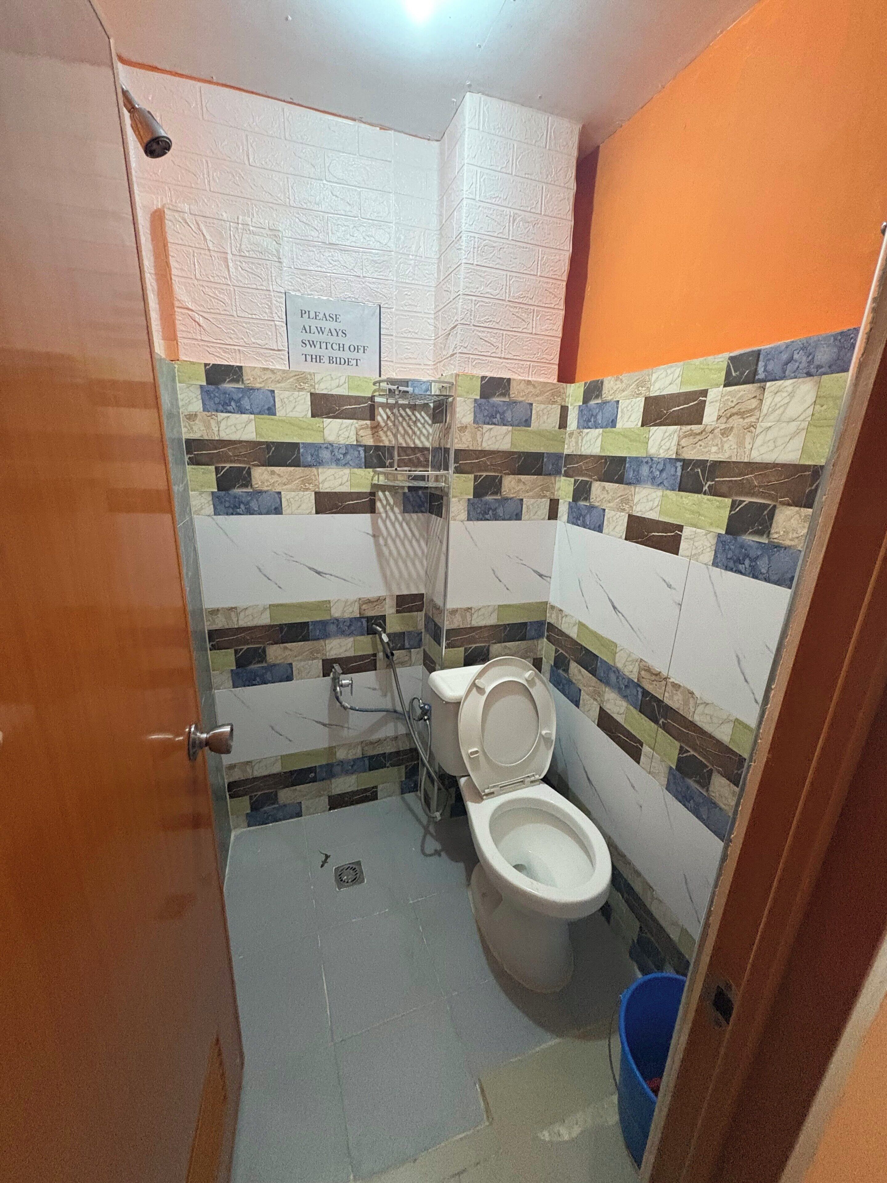Shower, towels, soap, toilet paper