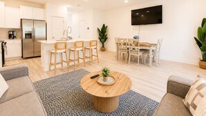 A modern apartment with a kitchen, dining area, and living room. - Quick Drive to Beach | Sleeps 6 (Santa Rosa Beach)