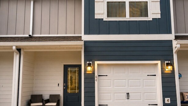 A two-story house with a garage, a front porch with chairs, and a mailbox. - Quick Drive to Beach | Sleeps 6 (Santa Rosa Beach)