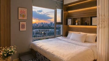Suíte estúdio, 1 cama Queen e sofá-cama, vista para a cidade | Escrivaninha, espaço de trabalho para notebook, cortinas blackout