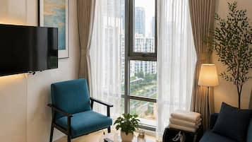 Suíte estúdio conforto, 2 camas Queen, vista para o parque | Área de estar
