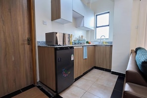 Family Apartment, 2 Bedrooms | Private kitchen | Fridge, microwave, oven, stovetop - Enkaji 77ApartHotel by Trianum (Nairobi)
