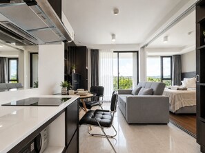 Apartment, Garden View | Living room - Aristo 1BR Coastal Escape in Surin Beach (Tambon Choeng Thale)