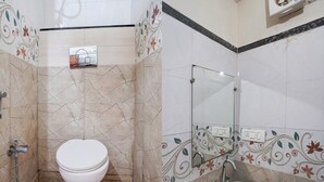 A bathroom with a toilet, sink, and shower. - Club Kanpur Central Railway Junction (Kanpur)