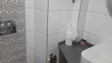 Hair dryer, slippers, towels, soap