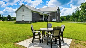 A house with a porch, a lawn, and a patio with chairs and a table. - Fun w/ Family! 'Country Getaway' in North Bangor (North Bangor)