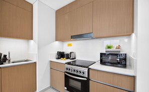 Premium Apartment, 1 Bedroom, Non Smoking | Private kitchen - Swimmable lagoon 1BR pool view (Dubai)