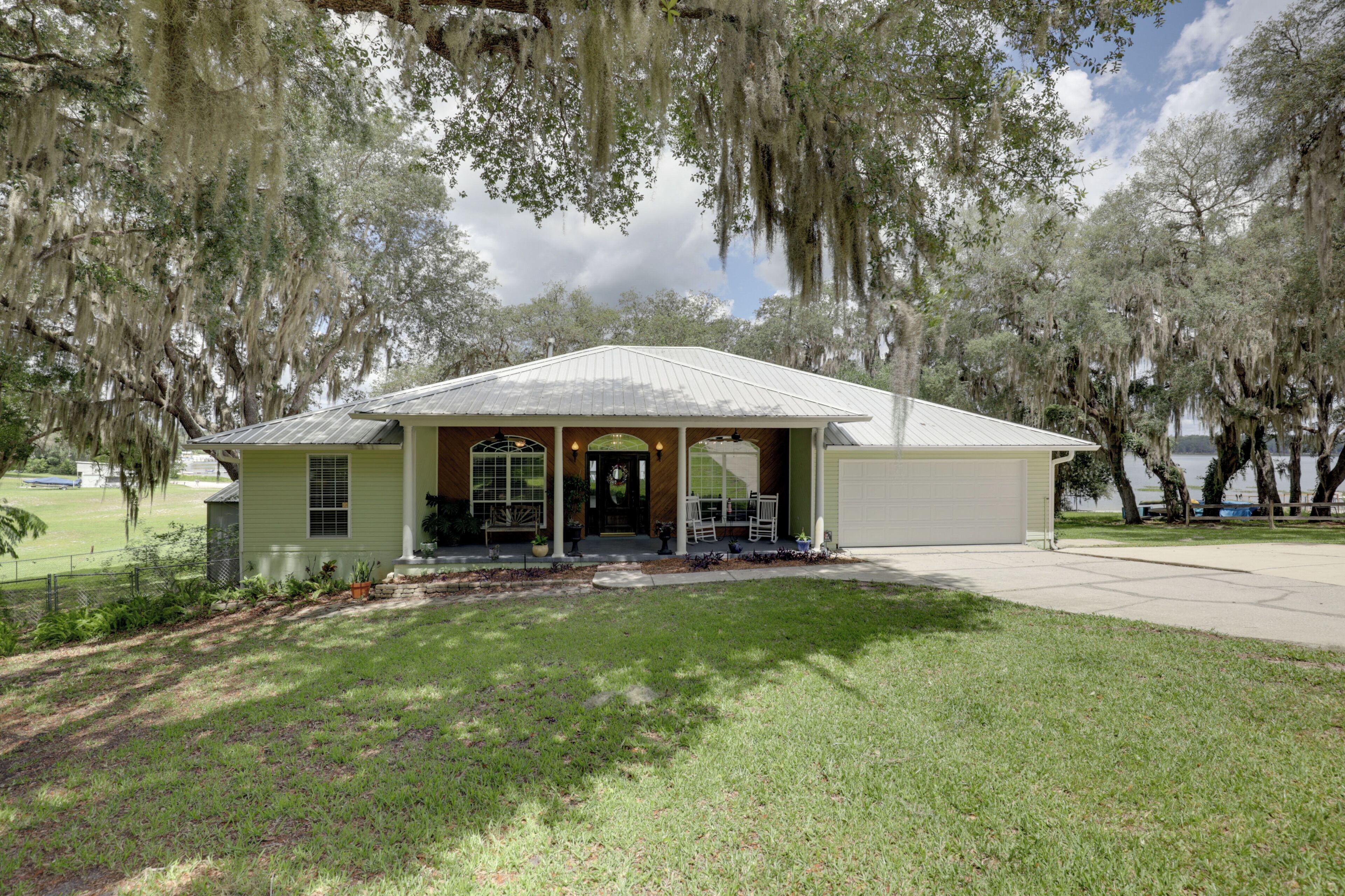A single-story building with a gabled roof, a front porch, and a covered entrance.