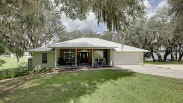 A single-story building with a gabled roof, a front porch, and a covered entrance.