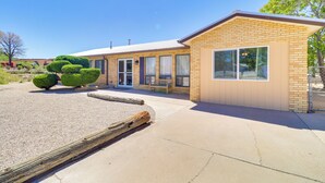 A modern building with a brick facade, large windows, and a covered outdoor seating area. - 2 Mi to Intel: Extended-Stay Retreat w/ Patio (Rio Rancho)