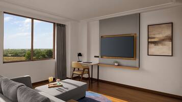 Una habitación de hotel moderna con un ventanal grande, un escritorio, un sofá cómodo y vistas al exterior.