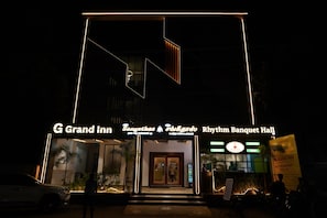 A hotel entrance with a sign reading 'G Grand Inn Sangethala Rhythm Banquet Hall.' - G Grand Inn (Thanjavur)