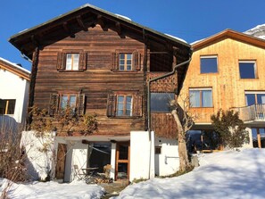 A wooden chalet with a sloped roof, multiple windows, and a covered entrance. - Casa Pintga, (Flims Dorf), 1819 by Interhome (Flims)