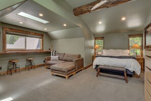 A bedroom with a bed, a sofa, a desk, and a window. - Walnut Woods: Studio, 1 BA Apartment in Homewood, Sleeps 2 (Homewood)