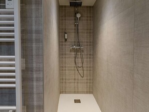 A modern shower with a control panel, a handheld showerhead, and a handheld faucet. - Cozy apartment - 6 guests, near slopes (Belle Plagne)