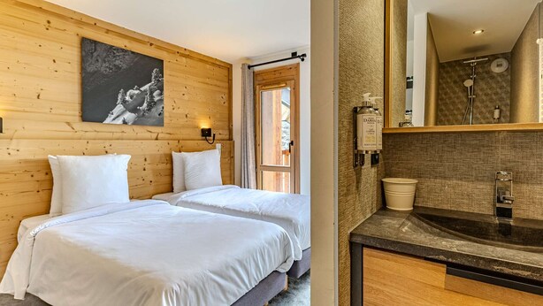 A hotel room with two beds, a wooden wall, a painting, a bathroom with a sink and mirror. - Cozy apartment - 6 guests, near slopes (Belle Plagne)