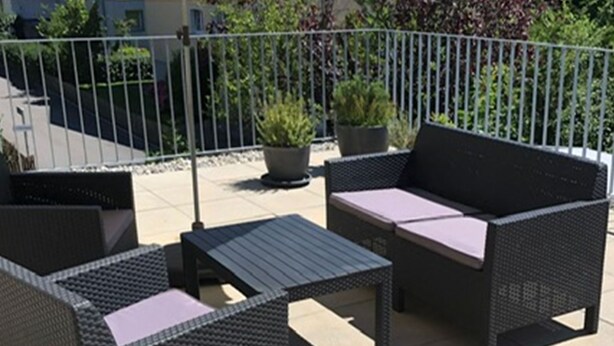 An outdoor patio with wicker furniture, including a sofa and a table. - Gäumann-Kiener, (Bad Ragaz), by Interhome (Bad Ragaz)