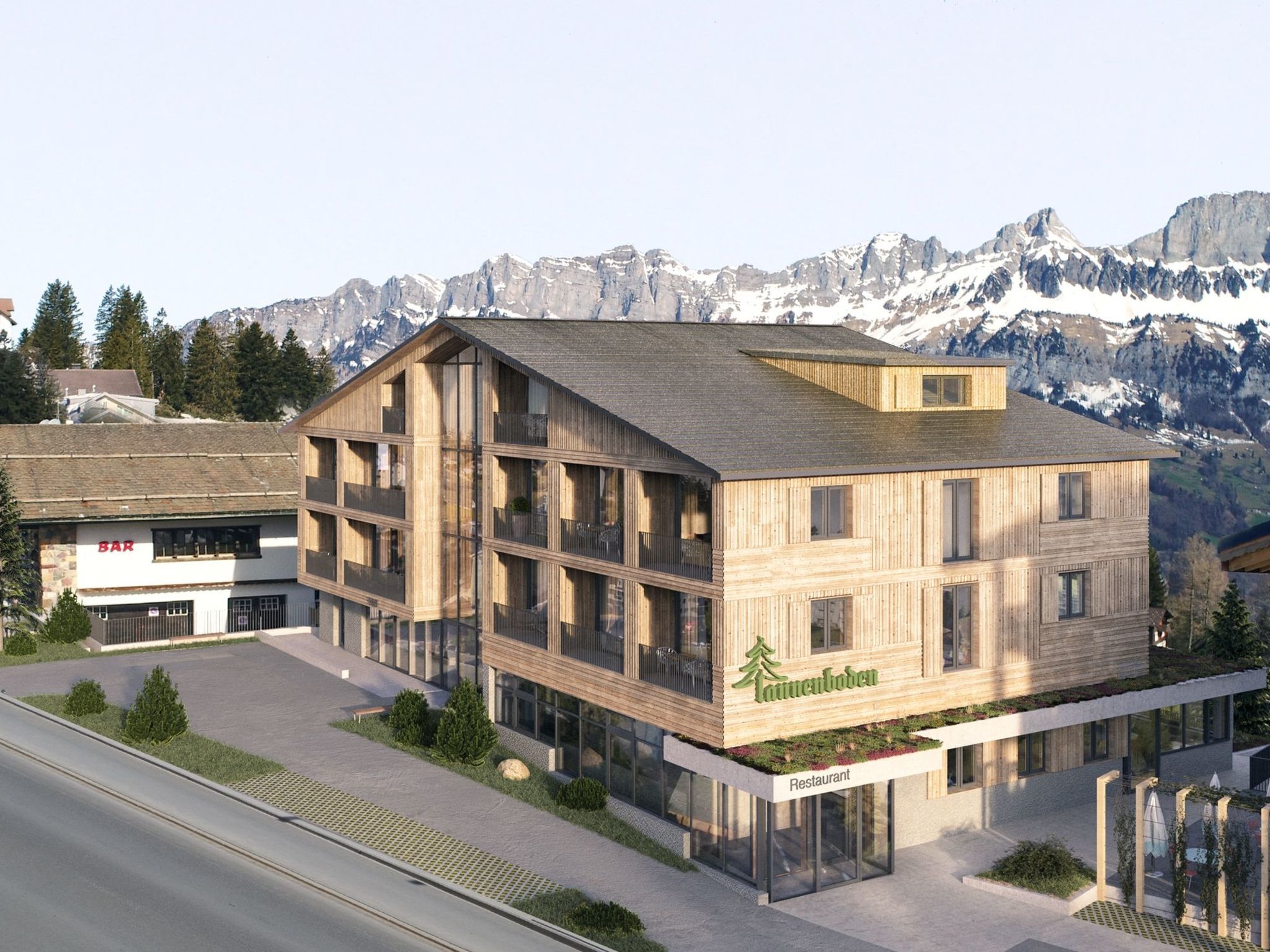 A multi-story wooden building with a restaurant sign, surrounded by mountains.