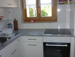 Fridge, microwave, oven, cookware/dishes/utensils - Chalet Rehwiesli, (Flumserberg Tannenheim), by Interhome (Flumserberg Tannenheim)