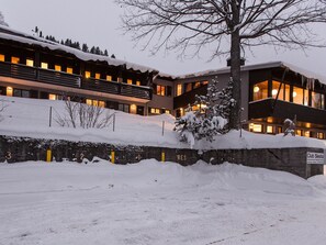 A multi-story building with a snow-covered roof and a sign indicating 'Club Siesta.' - Club Siesta Ferienwohnung/Studio, (Flumserberg Tannenheim), by Interhome (Flumserberg Tannenheim)