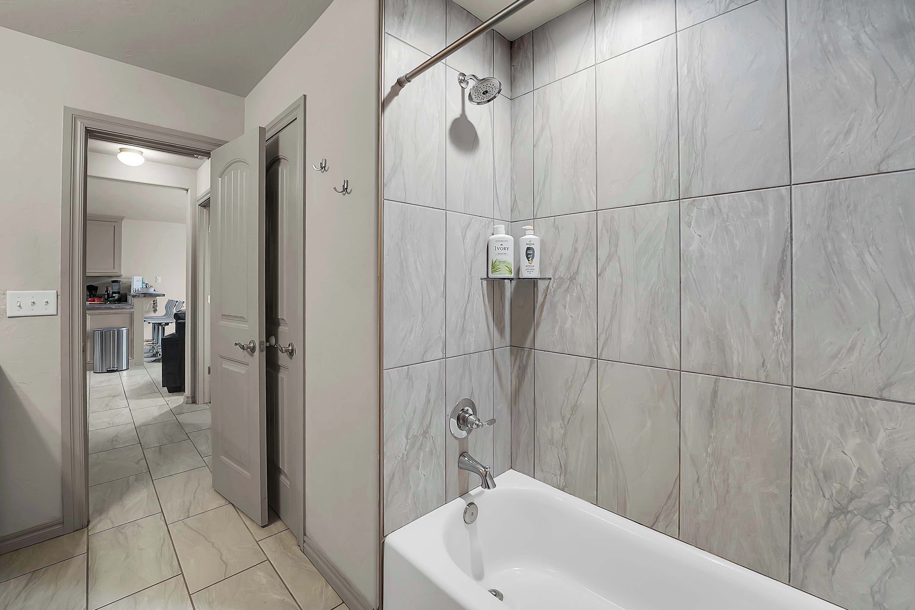 Shower, hair dryer, towels, shampoo