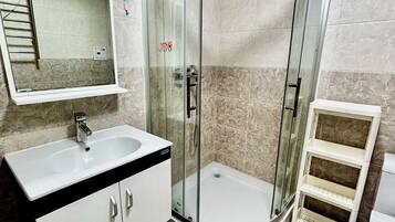 Shower, hair dryer, towels, soap